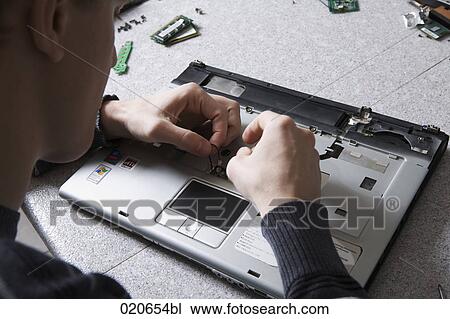 young worker repairing laptop computer View Large Photo Image Stock Image - young worker repairing laptop computer. Fotosearch