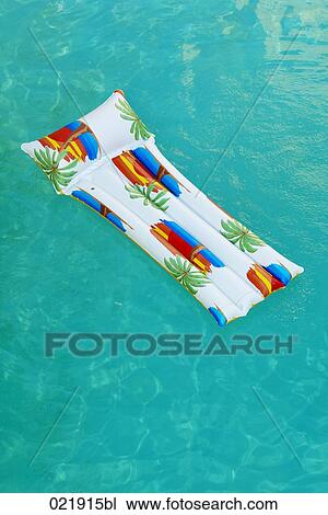 air bed floating in swimming pool View Large Photo Image Stock Image - air bed floating in swimming pool. Fotosearch