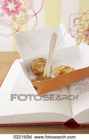box with little pancakes on book View Large Photo Image Stock Image - box with little pancakes on book. Fotosearch