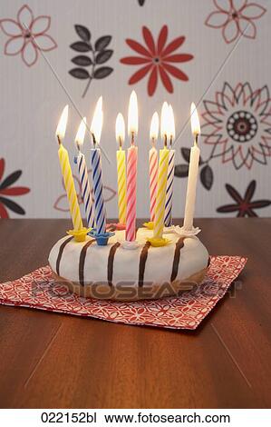 burning candles on donut View Large Photo Image Stock Image - burning candles on donut. Fotosearch