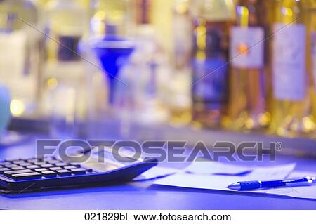 calculator and notes on table in bar View Large Photo Image Stock Image - calculator and notes on table in bar. Fotosearch