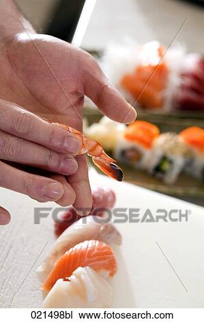 close-up of japanese chef making sushi View Large Photo Image Stock Image - close-up of japanese chef making sushi. Fotosearch