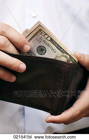 close-up of man taking dollar bill out of wallet View Large Photo Image Stock Image - close-up of man taking dollar bill out of wallet. Fotosearch