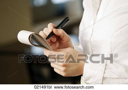 Stock Image - close-up of waitress taking an order. Fotosearch