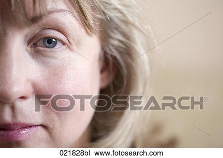 Stock Image - close-up of woman looking at camera. Fotosearch