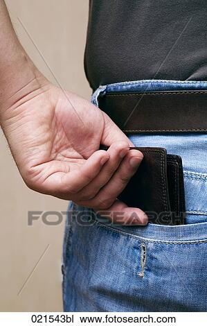 close-up of young man pulling wallet out of trouser pocket View Large Photo Image Stock Image - close-up of young man pulling wallet out of trouser pocket. Fotosearch