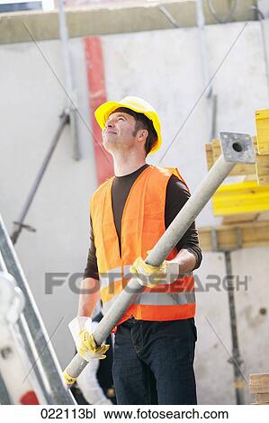 construction worker holding metal part View Large Photo Image Stock Image - construction worker holding metal part. Fotosearch