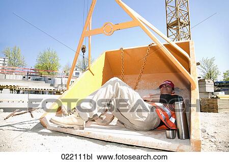 construction worker taking a nap in tipping skip View Large Photo Image Stock Image - construction worker taking a nap in tipping skip. Fotosearch