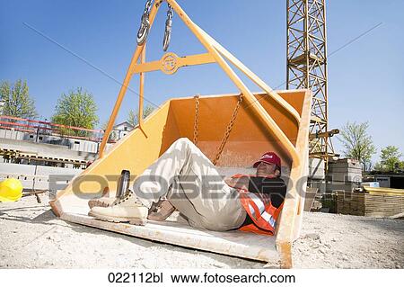 construction worker taking a nap in tipping skip View Large Photo Image Stock Image - construction worker taking a nap in tipping skip. Fotosearch