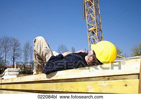 construction worker taking a nap on construction site View Large Photo Image Stock Image - construction worker taking a nap on construction site. Fotosearch