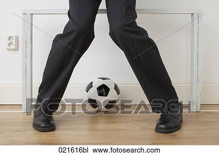 detail of businessman standing in goal at home View Large Photo Image Stock Image - detail of businessman standing in goal at home. Fotosearch