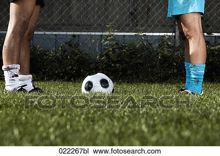 Stock Image - detail of two female football players standing face to face. Fotosearch