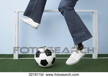 Stock Image - detail of woman with football. Fotosearch