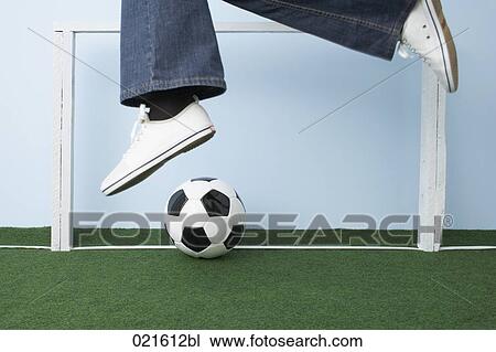Stock Image - detail of woman with football. Fotosearch