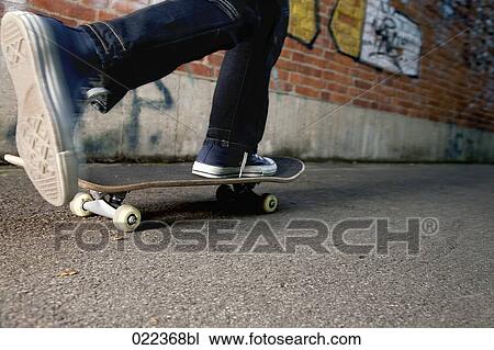 detail of young boy skateboarding View Large Photo Image Stock Image - detail of young boy skateboarding. Fotosearch