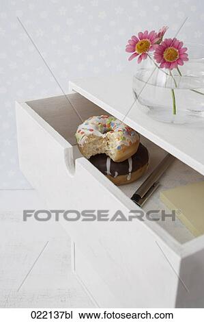 donuts hidden in drawer View Large Photo Image Stock Image - donuts hidden in drawer. Fotosearch