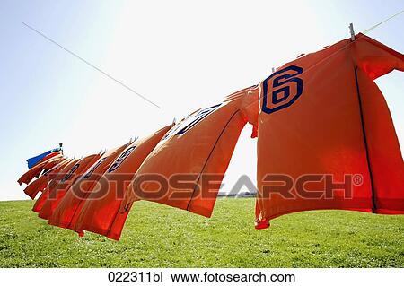 football dresses hanging on clothesline View Large Photo Image Stock Image - football dresses hanging on clothesline. Fotosearch