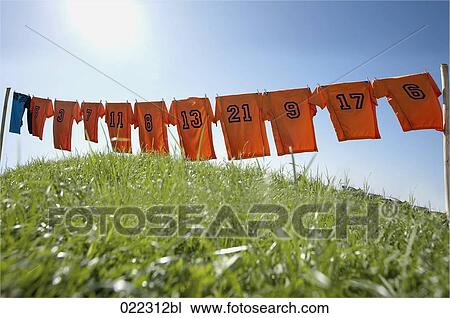 football dresses hanging on clothesline View Large Photo Image Stock Image - football dresses hanging on clothesline. Fotosearch