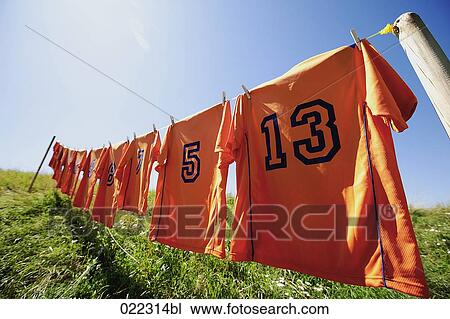 football dresses hanging on clothesline View Large Photo Image Stock Image - football dresses hanging on clothesline. Fotosearch
