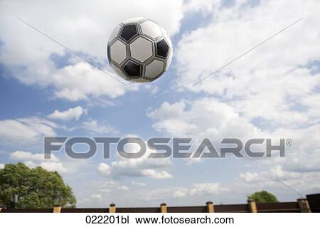 football flying through air View Large Photo Image Stock Image - football flying through air. Fotosearch
