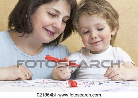 grandmother watching as little boy is drawing with felt tip pens View Large Photo Image Stock Image - grandmother watching as little boy is drawing with felt tip pens. Fotosearch