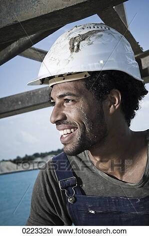 Stock Image - headshot of black worker. Fotosearch