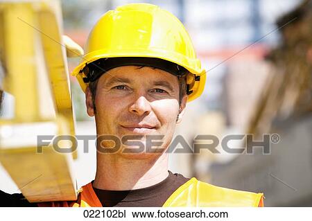headshot of construction worker carrying wooden plank View Large Photo Image Stock Image - headshot of construction worker carrying wooden plank. Fotosearch