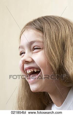 headshot of laughing young girl View Large Photo Image Stock Image - headshot of laughing young girl. Fotosearch