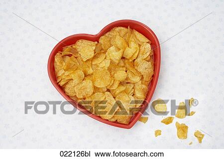 high angle view of crisps in heart shaped tray View Large Photo Image Stock Image - high angle view of crisps in heart shaped tray. Fotosearch