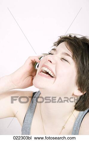 laughing teenage girl talking on mobile phone View Large Photo Image Stock Image - laughing teenage girl talking on mobile phone. Fotosearch