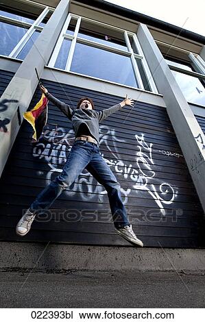 low angle view of young boy with flag jumping View Large Photo Image Stock Image - low angle view of young boy with flag jumping. Fotosearch