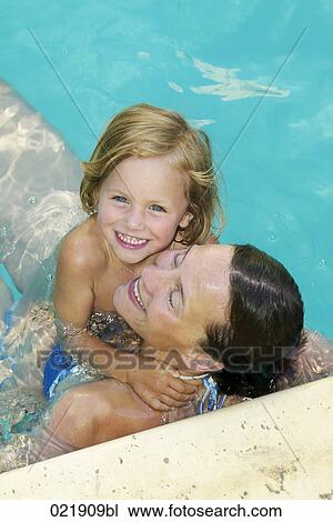mother and daughter together in swimming pool View Large Photo Image Stock Image - mother and daughter together in swimming pool. Fotosearch