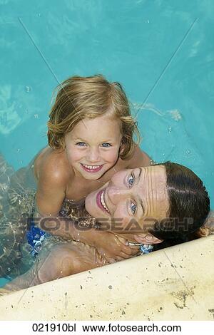 mother and daughter together in swimming pool View Large Photo Image Stock Image - mother and daughter together in swimming pool. Fotosearch