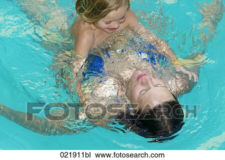 mother and daughter together in swimming pool View Large Photo Image Stock Image - mother and daughter together in swimming pool. Fotosearch