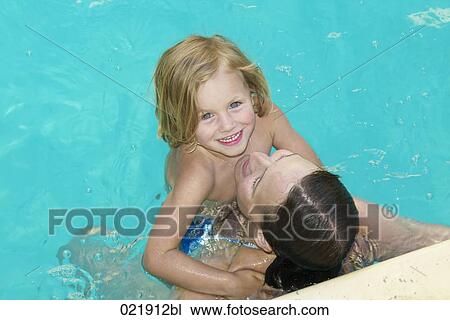 mother and daughter together in swimming pool View Large Photo Image Stock Image - mother and daughter together in swimming pool. Fotosearch