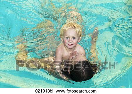 mother and son together in swimming pool View Large Photo Image Stock Image - mother and son together in swimming pool. Fotosearch