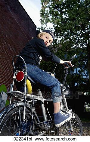 portrait of blond boy on chopper bicycle View Large Photo Image Stock Image - portrait of blond boy on chopper bicycle. Fotosearch