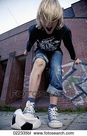 portrait of blond boy shouting and stepping on football View Large Photo Image Stock Image - portrait of blond boy shouting and stepping on football. Fotosearch