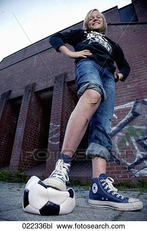 portrait of blond boy stepping on football View Large Photo Image Stock Image - portrait of blond boy stepping on football. Fotosearch