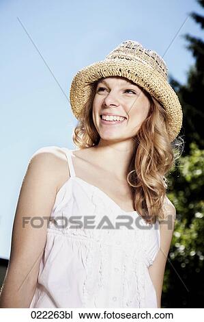 portrait of blonde woman with straw hat View Large Photo Image Stock Image - portrait of blonde woman with straw hat. Fotosearch