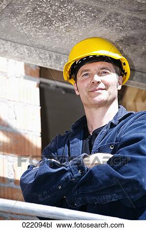 portrait of construction worker standing on scaffolding View Large Photo Image Stock Image - portrait of construction worker standing on scaffolding. Fotosearch