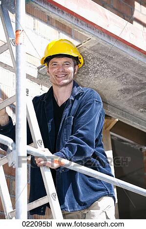 portrait of construction worker standing on scaffolding View Large Photo Image Stock Image - portrait of construction worker standing on scaffolding. Fotosearch