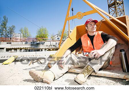 portrait of construction worker taking a break in tipping skip View Large Photo Image Stock Image - portrait of construction worker taking a break in tipping skip. Fotosearch