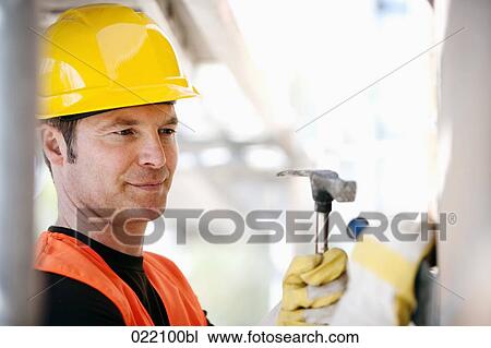 portrait of construction worker using hammer and chisel View Large Photo Image Stock Image - portrait of construction worker using hammer and chisel. Fotosearch