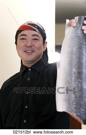 portrait of japanese chef holding fish View Large Photo Image Stock Image - portrait of japanese chef holding fish. Fotosearch