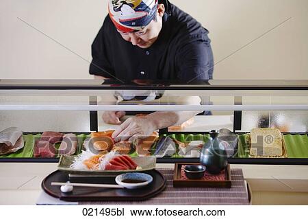 portrait of japanese chef in arranging sushi in restaurant View Large Photo Image Stock Image - portrait of japanese chef in arranging sushi in restaurant. Fotosearch