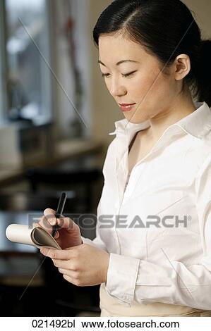 Stock Image - portrait of japanese waitress taking an order. Fotosearch