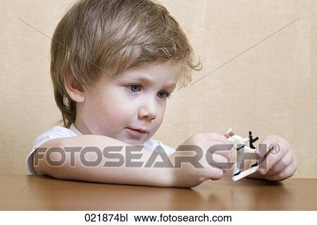 portrait of little boy playing with toy soldiers View Large Photo Image Stock Image - portrait of little boy playing with toy soldiers. Fotosearch