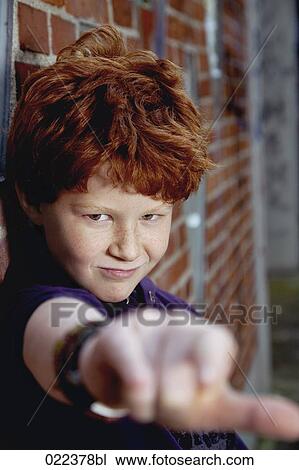portrait of red haired boy leaning against wall View Large Photo Image Stock Image - portrait of red haired boy leaning against wall. Fotosearch