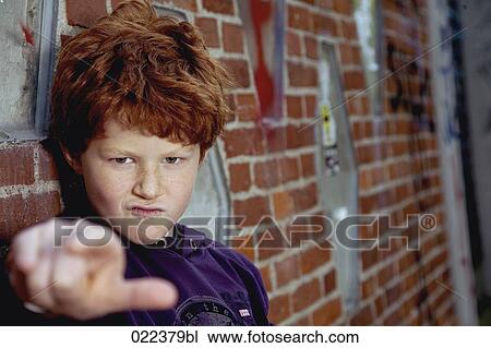 portrait of red haired boy leaning against wall View Large Photo Image Stock Image - portrait of red haired boy leaning against wall. Fotosearch
